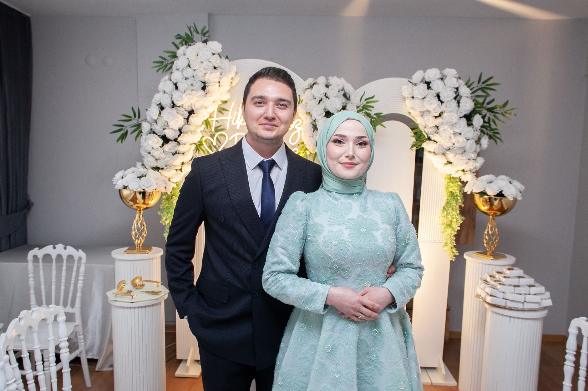 A newlywed couple posing elegantly at their wedding with floral decor indoors. — A Few Facts to Learn About CNC Machine