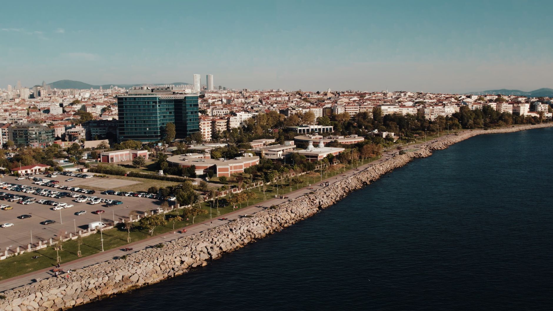 Aerial drone view of Istanbul's seaside cityscape featuring urban architecture and the Bosphorus shoreline. — Budgeting is ea