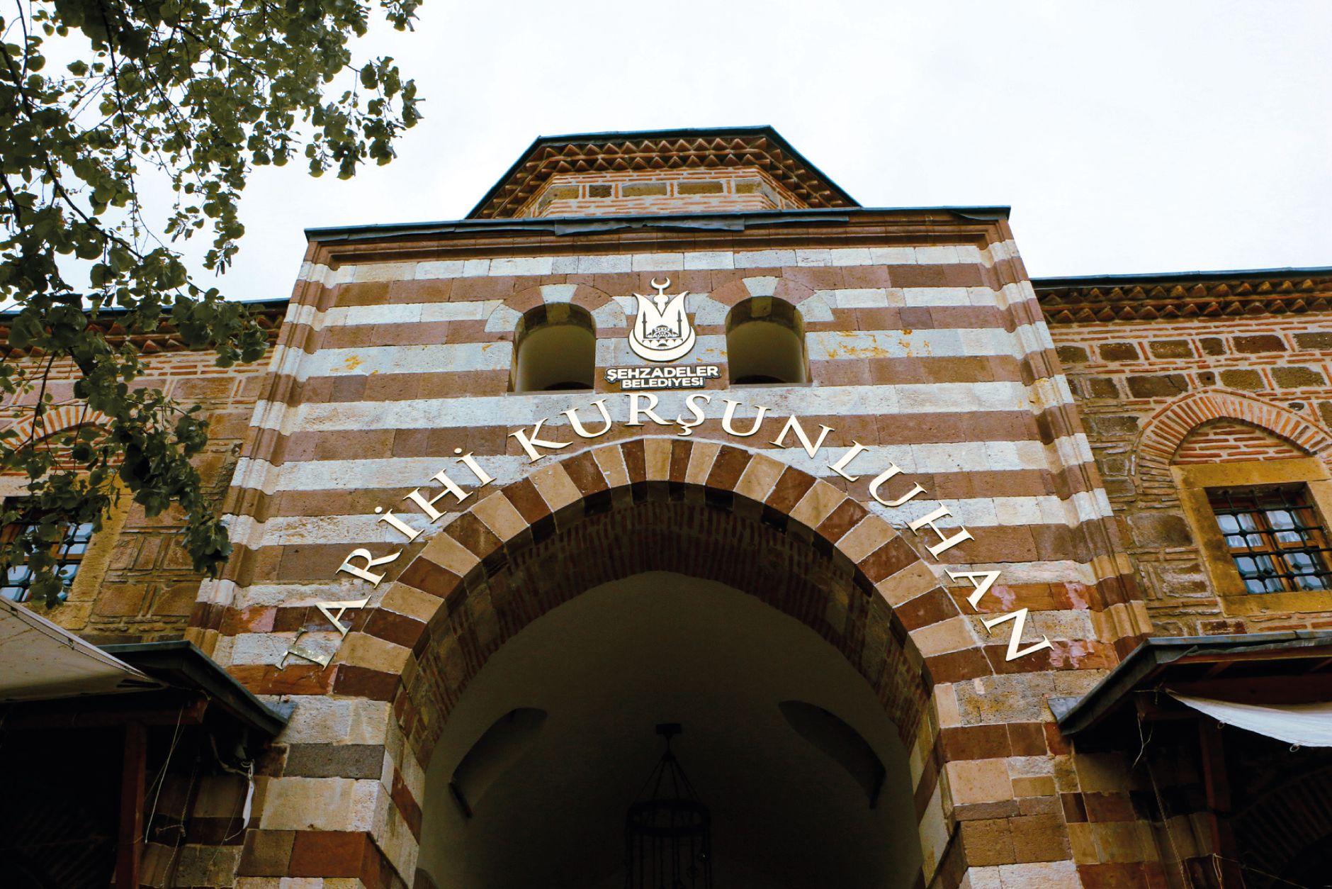 Entrance of the historic Kurşunlu Han in Manisa, Türkiye featuring traditional Ottoman architecture. — Can You Play BDG Games