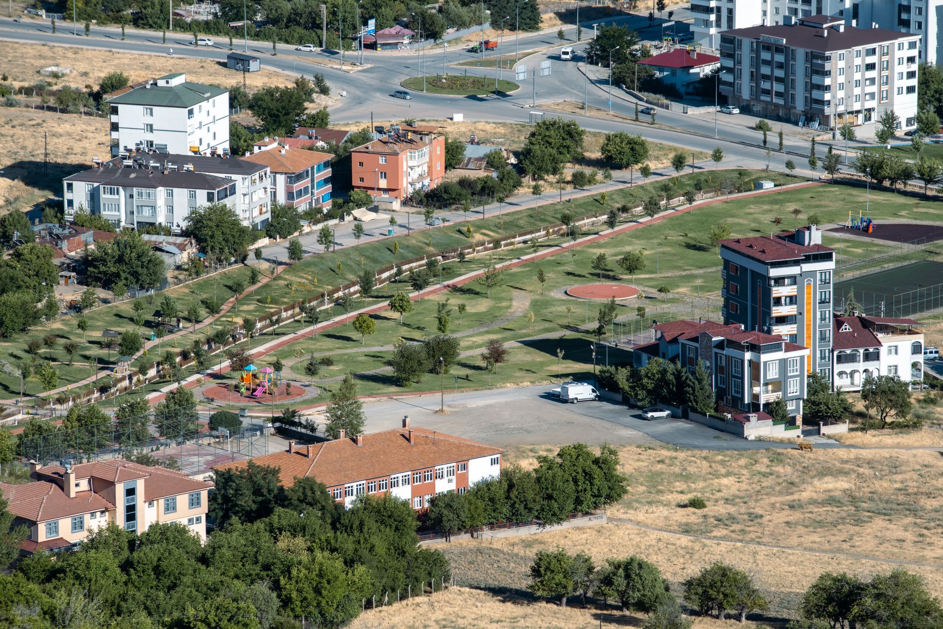 Aerial view showcasing urban and park areas in Elâzığ, Türkiye. — Find a Night Job That Suits You!