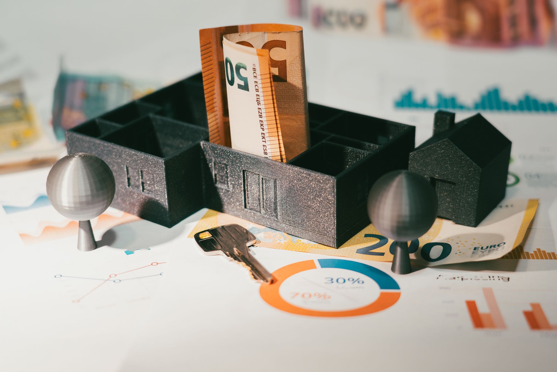 Euro notes with house model and financial charts symbolize real estate investment and economic growth. — How to Calculate the