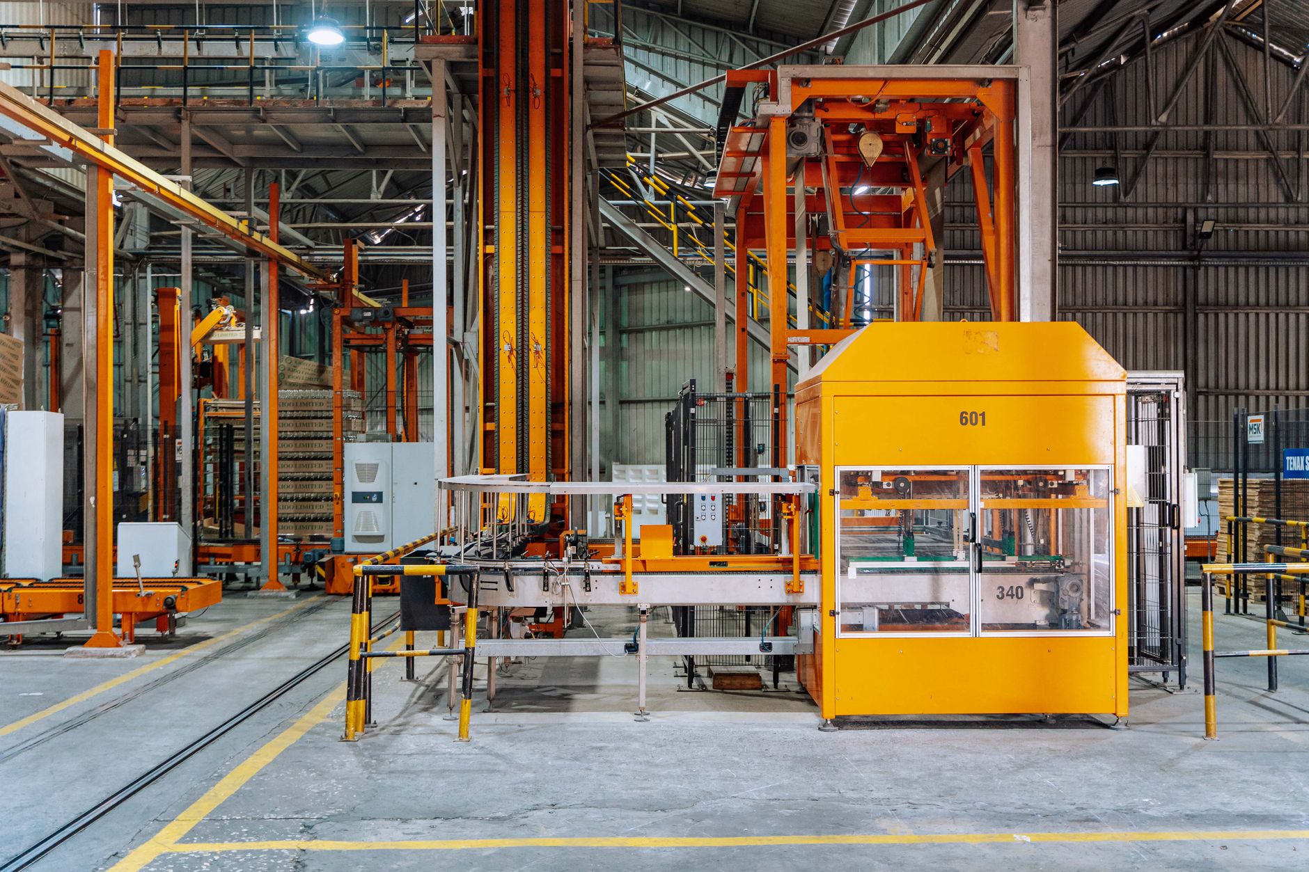 Detailed view of machinery in an operational glass factory in Dar es Salaam. — Know What Goes into the Things, We Put Things