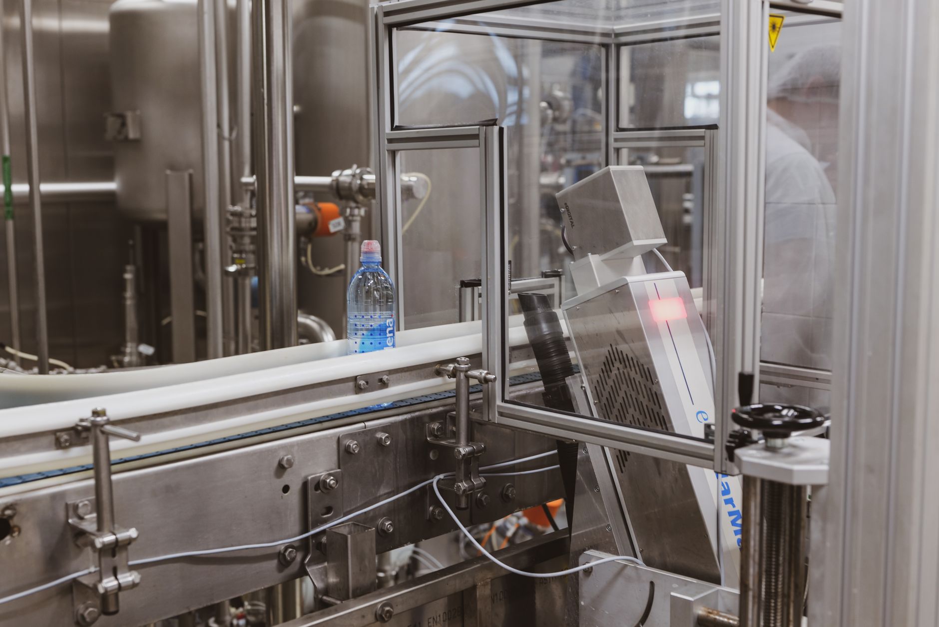 Close-up of a plastic bottle in a modern factory bottling production line. — The Misconceptions about Prefabricated Construct