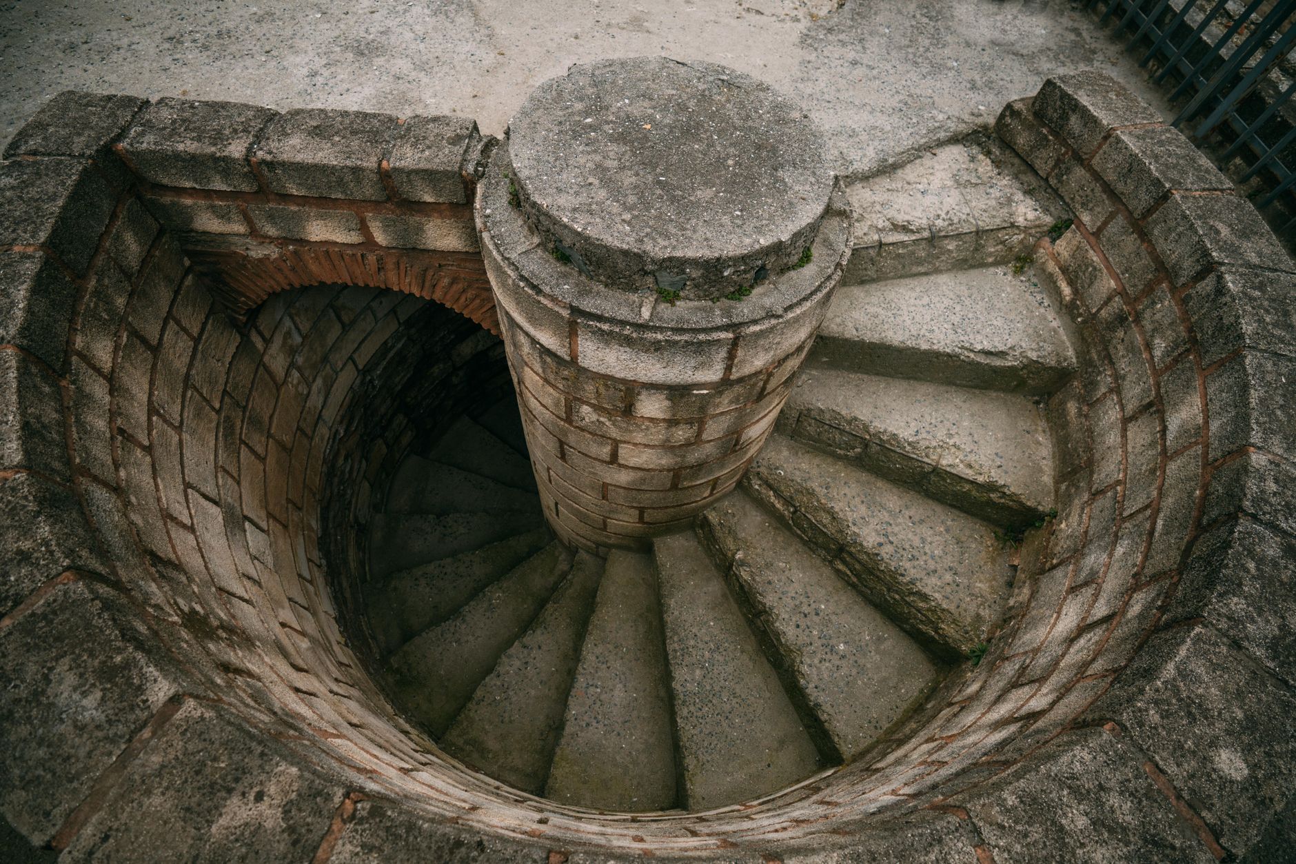 Top view of a spiraling stone staircase outdoors, showcasing architectural beauty. — Types of Businesses in Indonesia